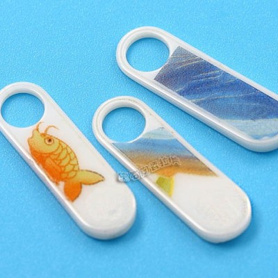 新彩陶瓷拉片 箱包服装饰品拉链片 拉牌 支持定制生产